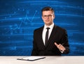 Stock data analyst in studio giving adivce on blue chart background Royalty Free Stock Photo