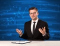 Stock data analyst in studio giving adivce on blue chart background Royalty Free Stock Photo