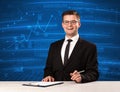 Stock data analyst in studio giving adivce on blue chart background Royalty Free Stock Photo
