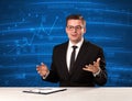 Stock data analyst in studio giving adivce on blue chart background Royalty Free Stock Photo