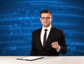 Stock data analyst in studio giving adivce on blue chart background Royalty Free Stock Photo