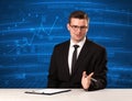 Stock data analyst in studio giving adivce on blue chart backgro Royalty Free Stock Photo