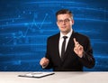 Stock data analyst in studio giving adivce on blue chart backgro Royalty Free Stock Photo