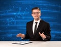 Stock data analyst in studio giving adivce on blue chart background Royalty Free Stock Photo