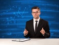 Stock data analyst in studio giving adivce on blue chart background Royalty Free Stock Photo