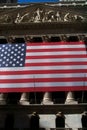 Stock Exchange of New York City, with the United Stated of America flag stars and stripes.