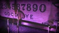Stock Footage Pan tilt down giant Ouija old film overlay board night Manhattan