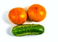 Stock Foto Closeup of yellow orange tomato and cucumber isolated on white background Royalty Free Stock Photo
