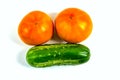 Stock Foto Closeup of yellow orange tomato and cucumber isolated on white background Royalty Free Stock Photo