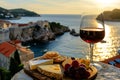 Cheese Platter with Plavac Mali Red Wine Overlooking a Serene Mediterranean Seascape Royalty Free Stock Photo