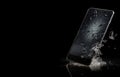 A shattered mobile phone - falling - broken - crushed - explosion - damaged - generic model - shards of broken screen