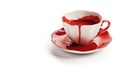 Blood in a teacup. Dripping red blood. White background.