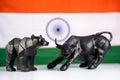 Stock market bull and bear with Indian flag as background - Concept of investment in Indian equity sensex share market