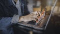 Stock market data candlesticks are indicators of the rising stocks There is a background image of a business man typing on a lapto Royalty Free Stock Photo