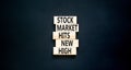 Stock market hits new high symbol. Concept words Stock market hits new high on wooden blocks on a beautiful black table black Royalty Free Stock Photo