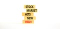 Stock market hits new high symbol. Concept words Stock market hits new high on wooden blocks on a beautiful white table white Royalty Free Stock Photo