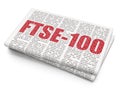 Stock market indexes concept: FTSE-100 on Newspaper background Royalty Free Stock Photo