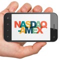 Stock market indexes concept: Hand Holding Smartphone with NASDAQ-AMEX on display Royalty Free Stock Photo