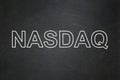 Stock market indexes concept: NASDAQ on chalkboard background