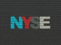 Stock market indexes concept: NYSE on wall background