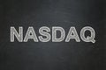 Stock market indexes concept: NASDAQ on chalkboard background