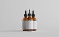 Amber Glass Dropper Bottle Mockup - Three Bottles. Blank Label. 3D Illustration