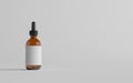 Amber Glass Dropper Bottle Mockup - One Bottle. Blank Label. 3D Illustration