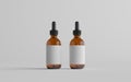 Amber Glass Dropper Bottle Mockup - Two Bottles. Blank Label. 3D Illustration