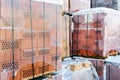 Stock pallets of red bricks wrapped in stretch film at wholesale outdoor market ot store. Construction site with prepared Royalty Free Stock Photo