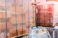 Stock pallets of red bricks wrapped in stretch film at wholesale outdoor market ot store. Construction site with prepared Royalty Free Stock Photo