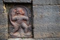 Stock photo of Ancient ruined archeological sculpture of hindu god hanuman engraved on gray stone wall at Kolhapur, India. Royalty Free Stock Photo