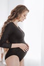 Beauty Pregnant Woman in black clothes Royalty Free Stock Photo