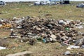 Stock photo of building rubble and garbage collection bags and other plastic objects and trash on waste disposal site