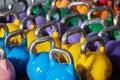 Colorful dumbbells from close in a Gym