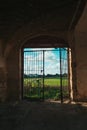 Abandoned Ruin in Southern Italy with Open Gate and Scenic Italian Landscape Beyond Royalty Free Stock Photo