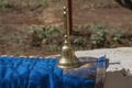 Stock photo of carved designer copper or bronze bell or hand bell used for worshiping god in hindu temples. bell kept on wall