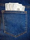 Stock photo cash money in us dollar currency and in the denim blue jeans back pocket Royalty Free Stock Photo