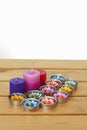 Stock Photo:Colorful candles on wooden tablt with white backgro