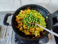 Stock photo of delicious, hot Indian mix vegetable curry, mix veg containing green peace, onion, tomato, potato cauliflower and Royalty Free Stock Photo