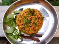 Stock photo of delicious popular South Indian rice dish puliyogare, its also called pulihora or puliyodarai garnished with dry