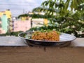 Stock photo of delicious popular South Indian rice dish puliyogare, its also called pulihora or puliyodarai garnished with dry