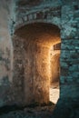 Typical Italian structure with a tunnel illuminated by beautiful yellow sunlight in the ghost town of Craco Royalty Free Stock Photo
