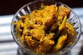 Stock photo of fresh lime chilli mix pickle kept in glass bowl under natural light, delicious testy homemade pickle