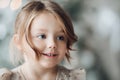 Beautiful little girl smiling away. Adorable young girl smiling away in close-up.