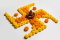 Stock photo of hindu auspicious symbol called Swastika or swastik made using marigold flower/zendu/genda phool & diwali diya / cla Royalty Free Stock Photo