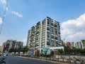 Stock photo of Indian cityscape. newly build tall residencial buildings and apartments,people riding vehicles of road at hyderabad