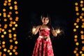 Stock photo of indian little girl holding fulzadi or sparkle or fire cracker on diwali night Royalty Free Stock Photo