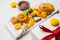 Indian sweets or Mithai for diwali festival with oil lamp or diya and gift box Royalty Free Stock Photo