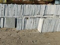 Stock photo of large number of grey kota stone piled up on another for sale in bright sunlight at gulbarga karnataka India. focus