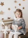 Little beautiful girl near the festive christmas tree Royalty Free Stock Photo